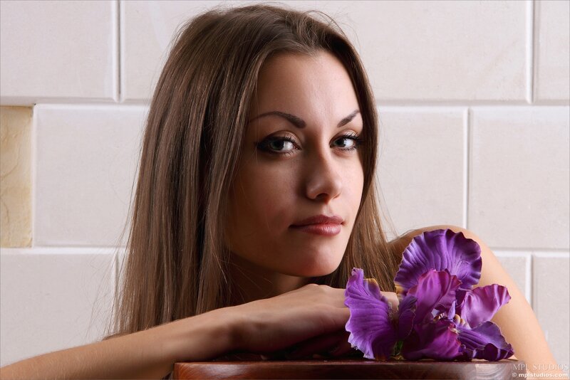 woman with purple flower