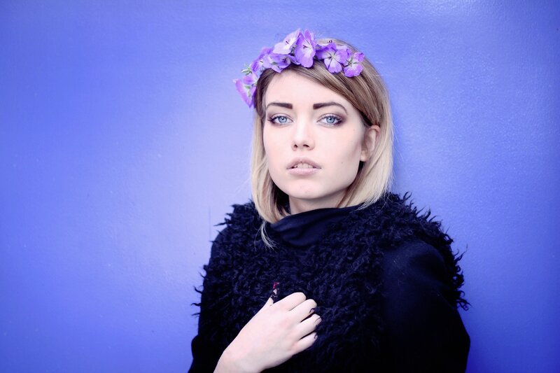 woman with purple flower crown