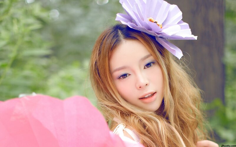 woman with purple flower headband