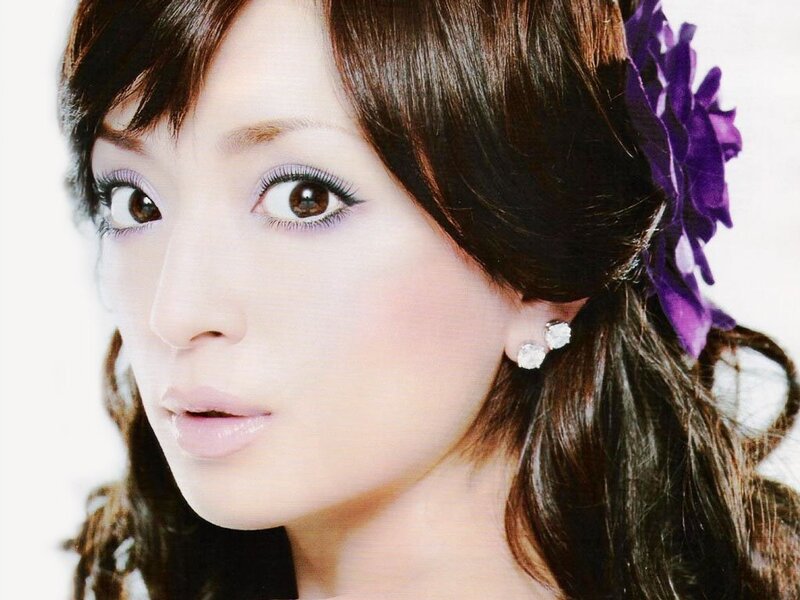 woman with purple flower in hair