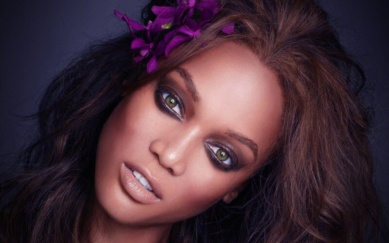 woman with purple flowers in hair