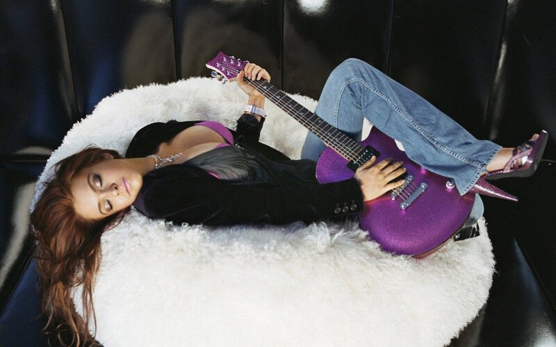 Woman with purple guitar