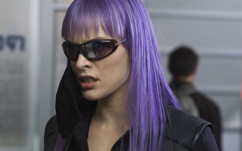 woman with purple hair and sunglasses