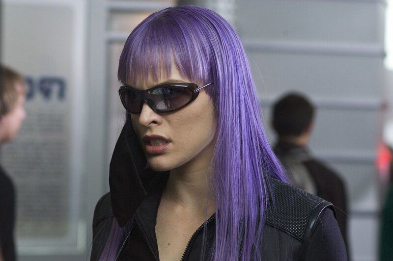 woman with purple hair and sunglasses