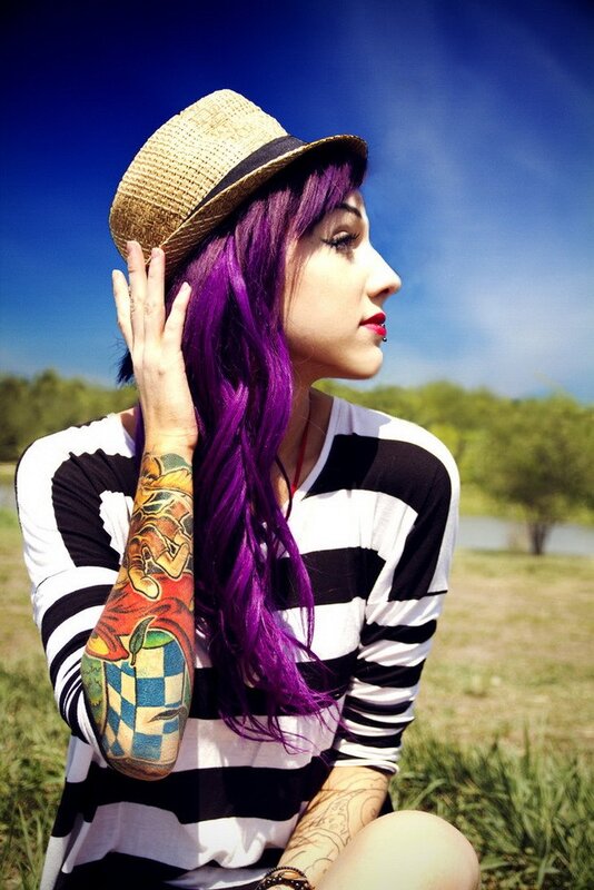 woman with purple hair and tattoos