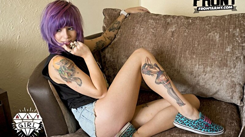 woman with purple hair and tattoos