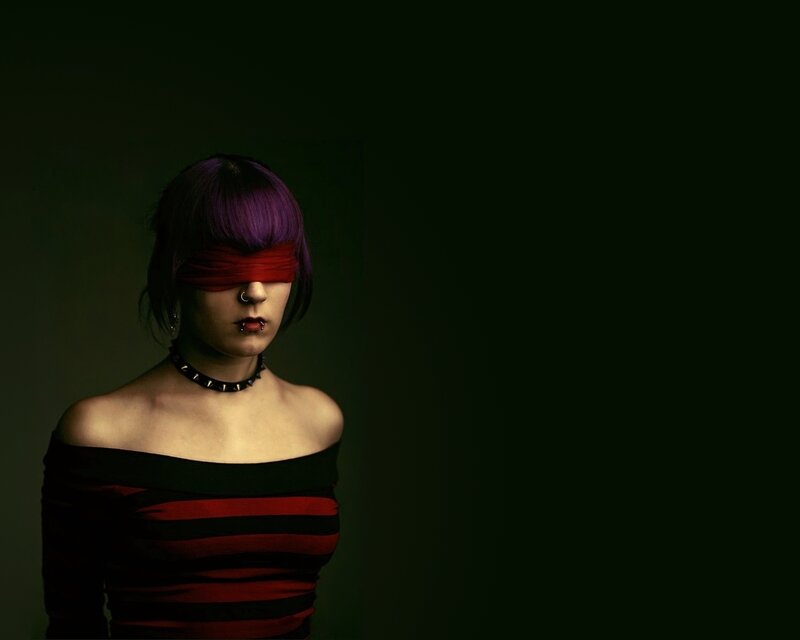 woman with purple hair blindfolded