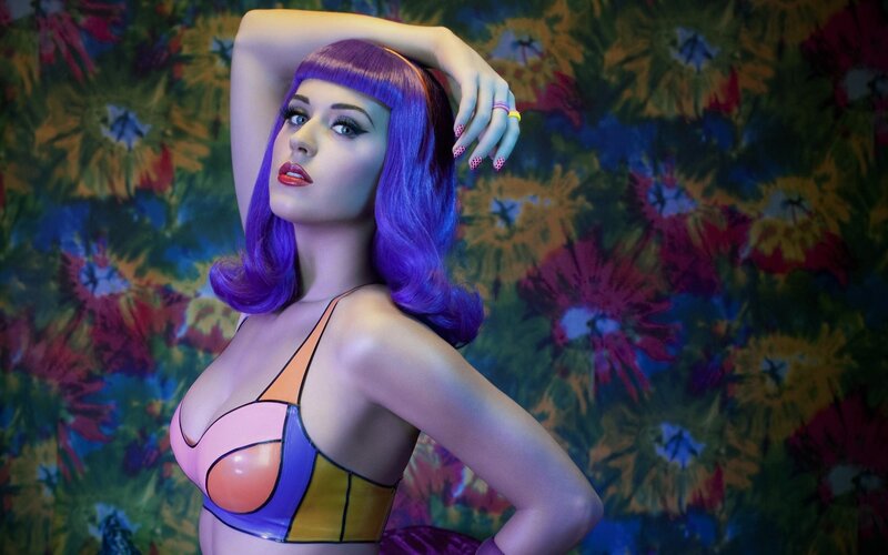 woman with purple hair in colorful setting