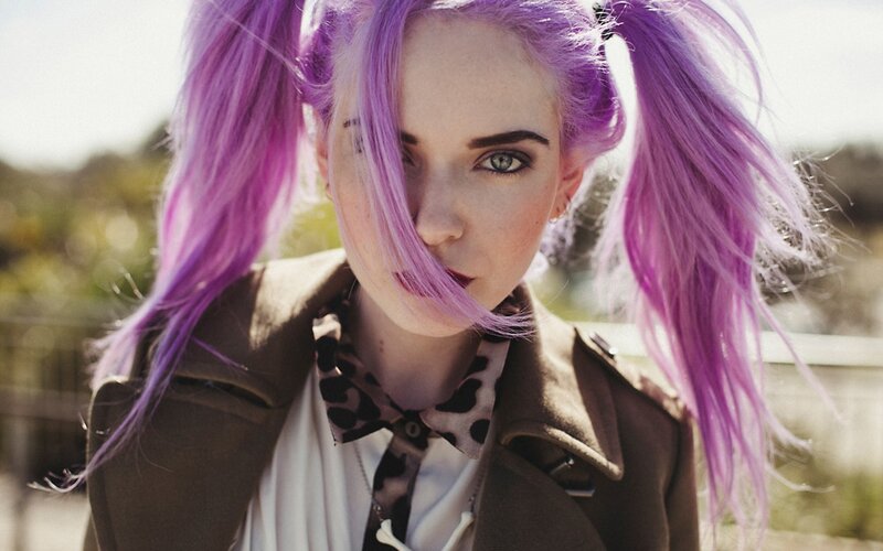 woman with purple hair in pigtails