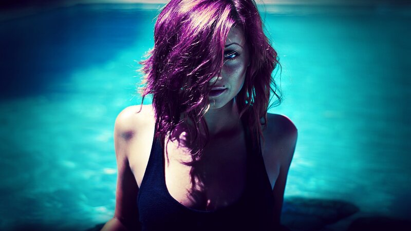 woman with purple hair in water