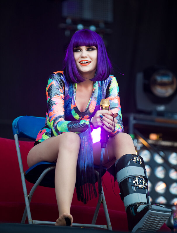 Woman with purple hair on stage