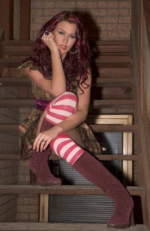 woman with purple hair on stairs