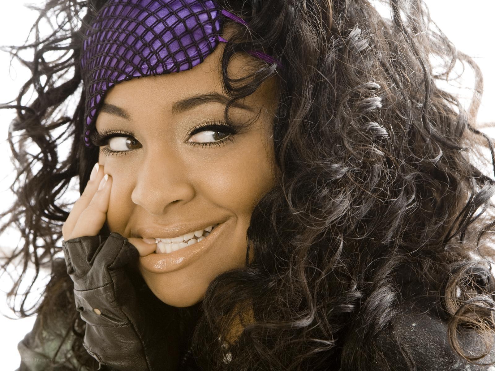 woman with purple headband smiling
