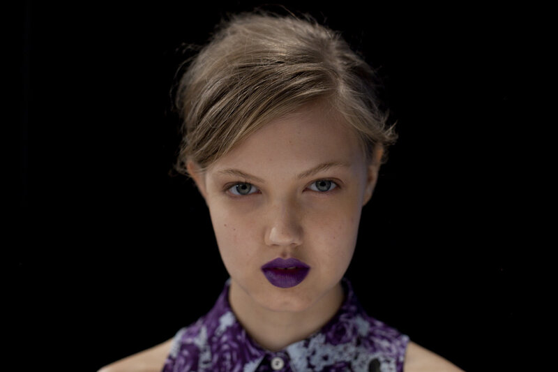 woman with purple lipstick
