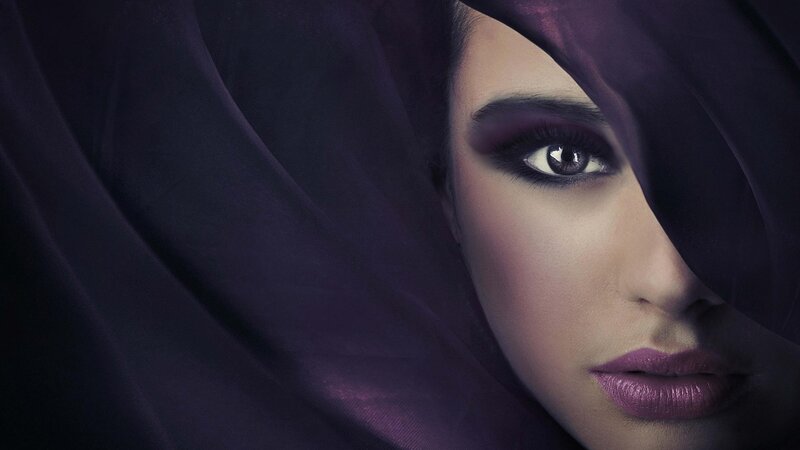 woman with purple makeup