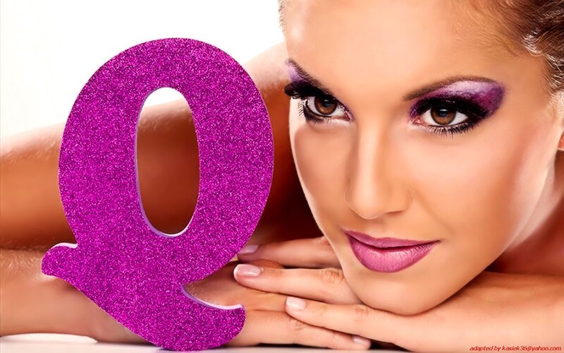 woman with purple makeup and glittery Q