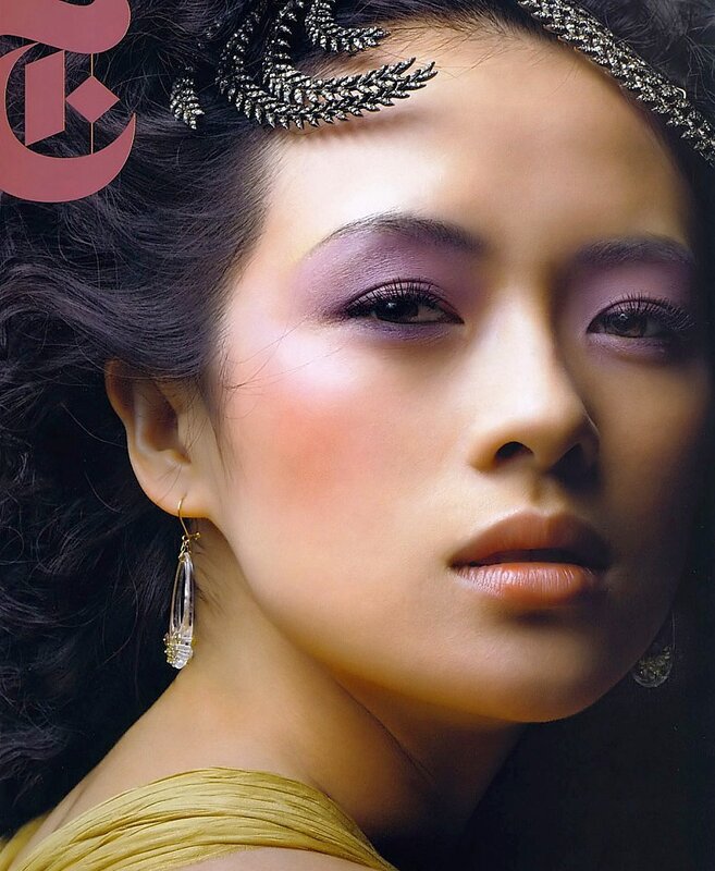 woman with purple makeup and headpiece
