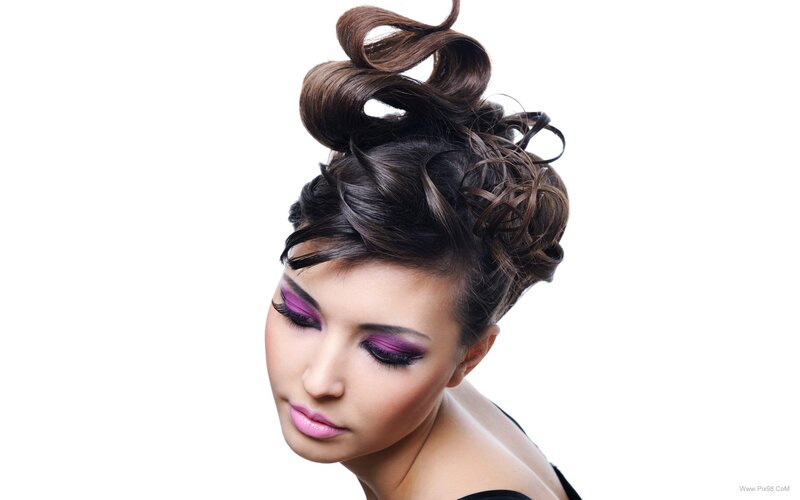 woman with purple makeup and updo