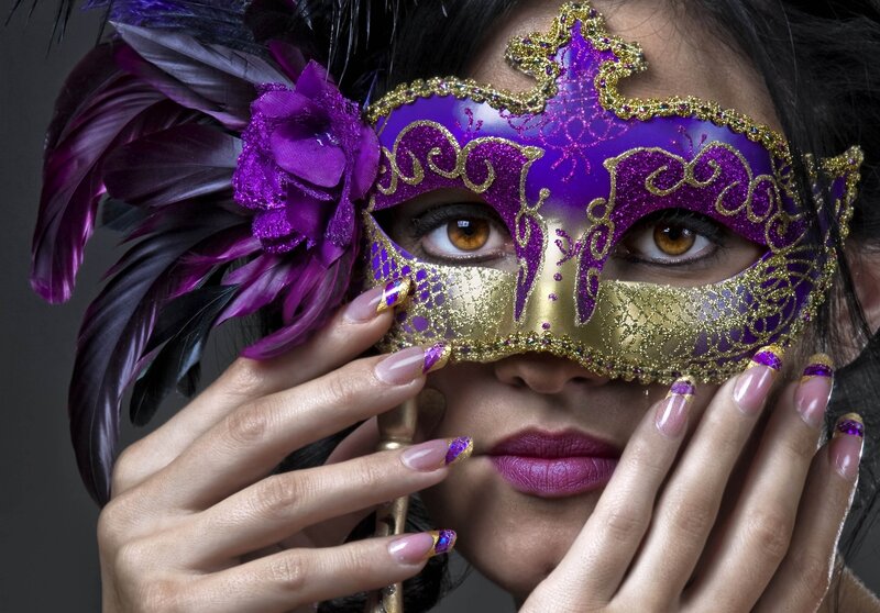 woman with purple masquerade mask