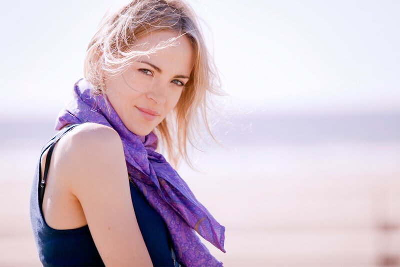 woman with purple scarf at beach