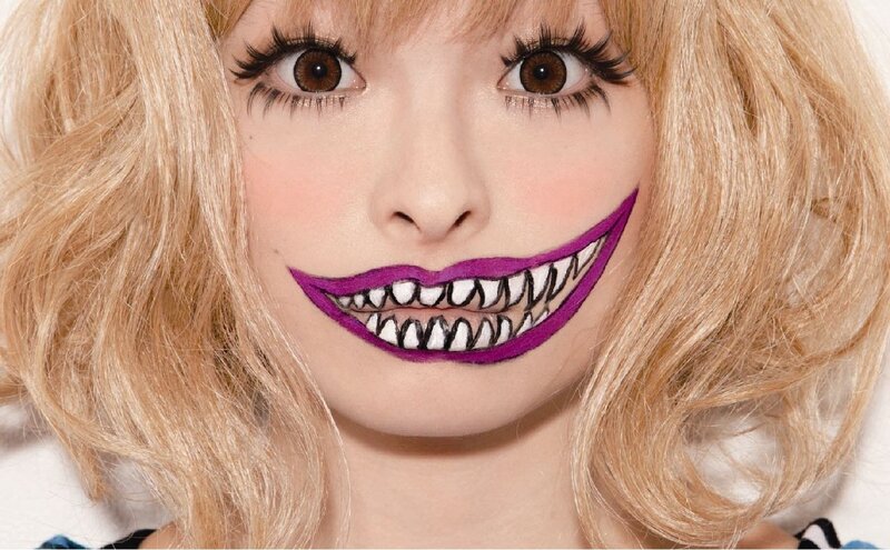 woman with purple smile makeup