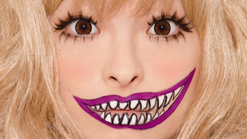 woman with purple smile makeup