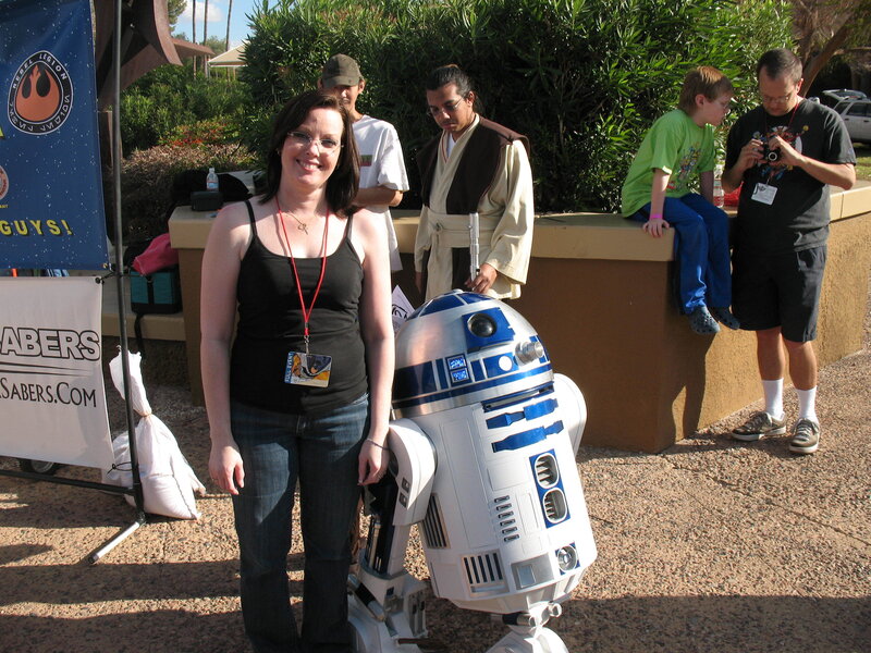Woman with R2-D2 at event