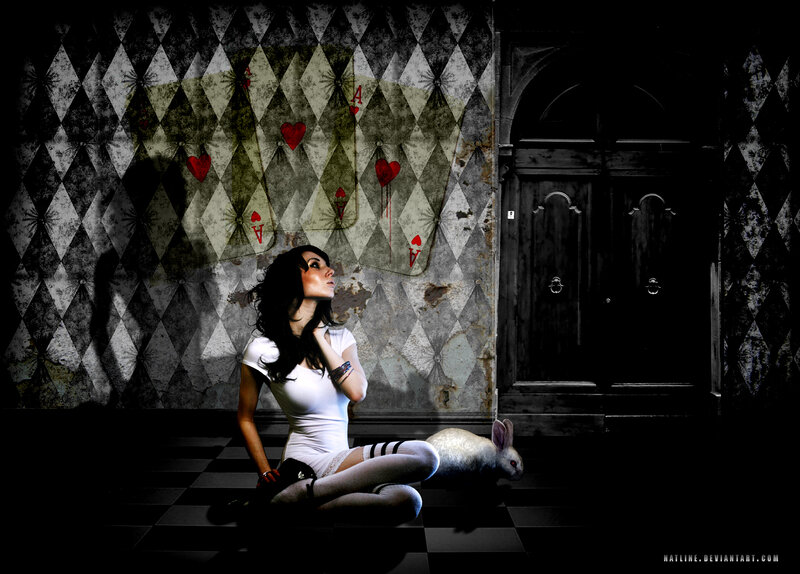 woman with rabbit in card-themed room