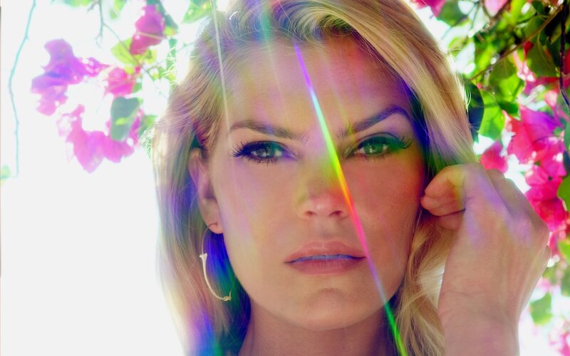 woman with rainbow lens flare