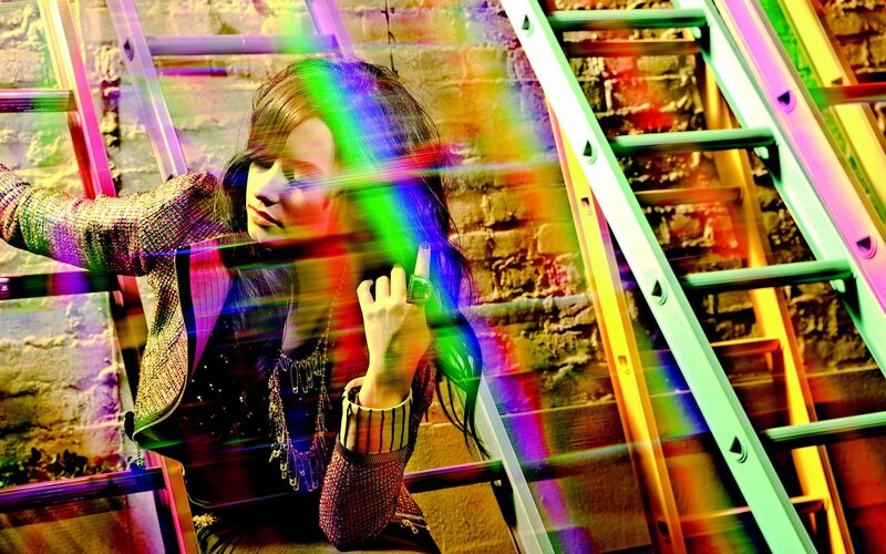 woman with rainbow light effects