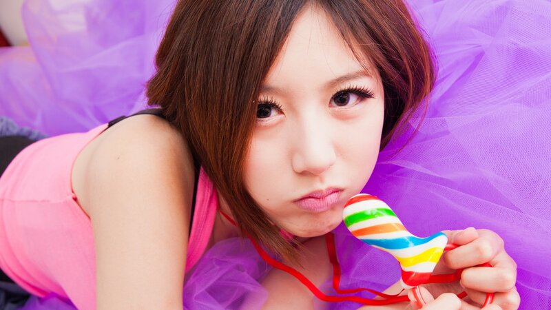 woman with rainbow lollipop