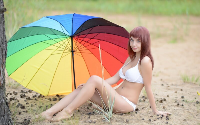 Woman with rainbow umbrella