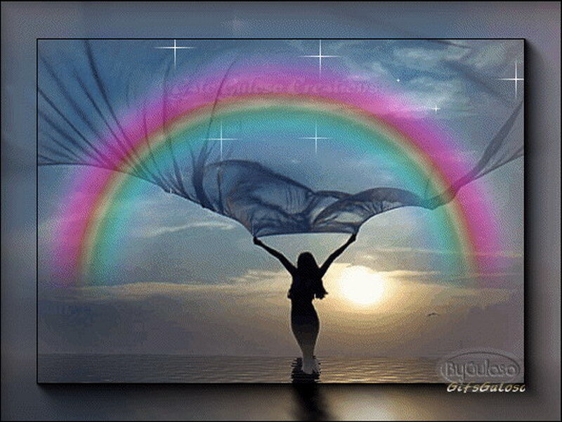 Woman with rainbow wings at sunset