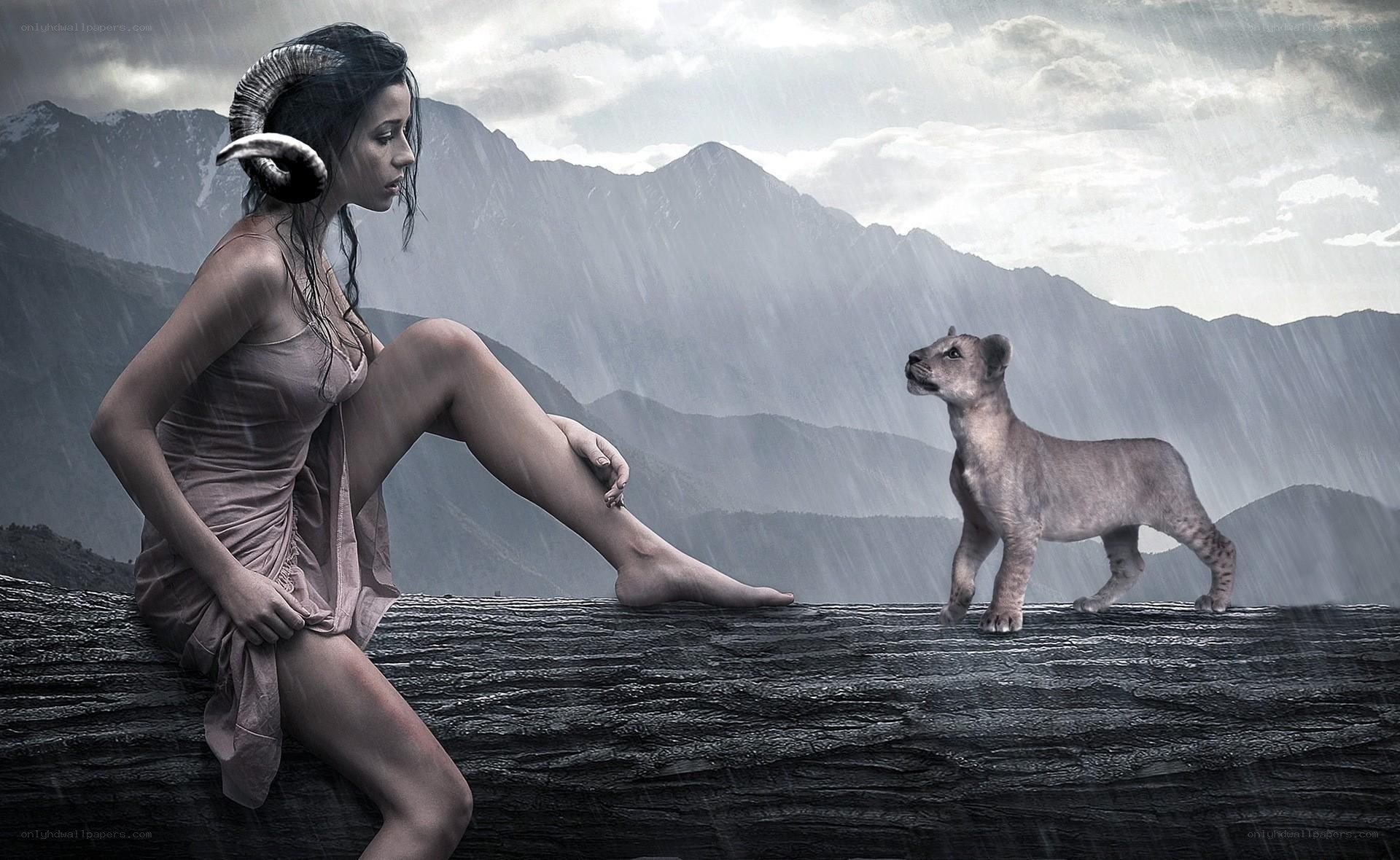 Woman with ram horns and lion cub