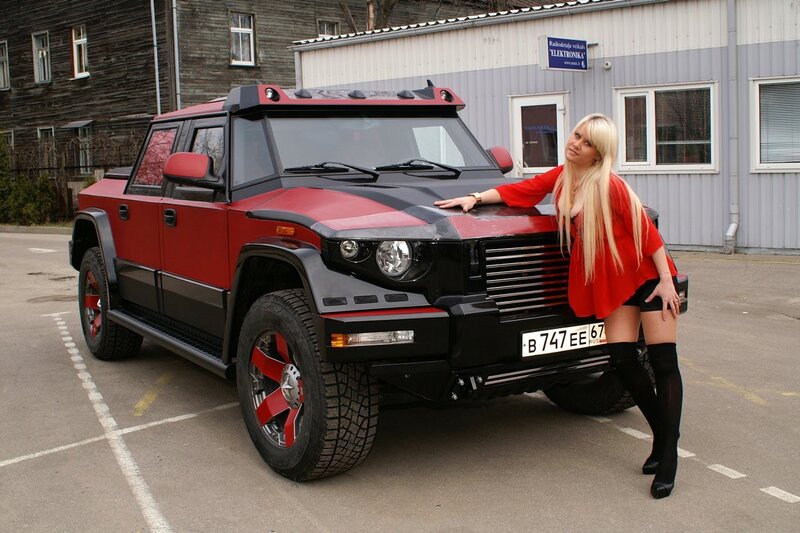 Woman with red and black SUV