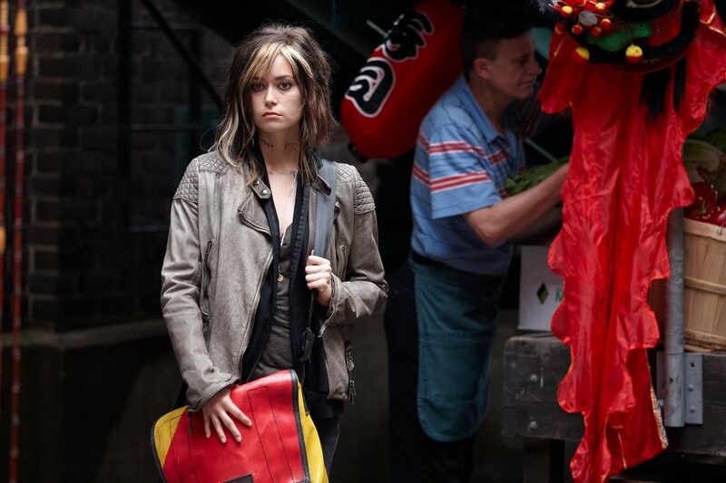 Woman with red bag on street