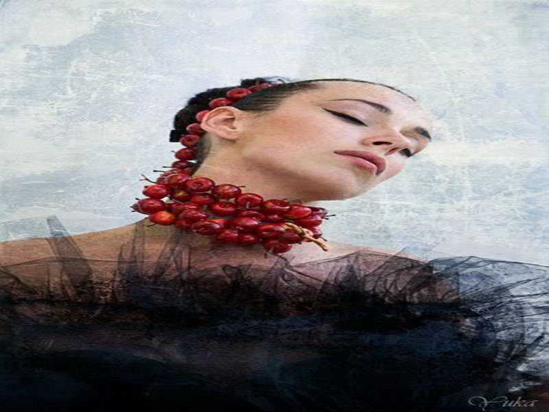 woman with red berry necklace