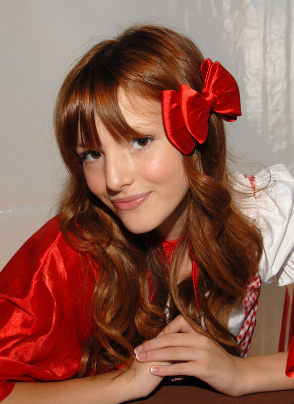 woman with red bow in hair