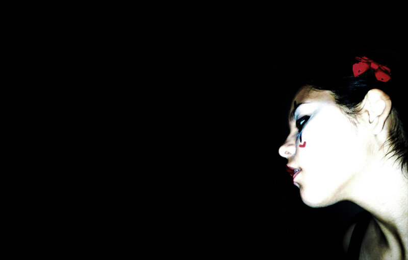 woman with red bow in profile