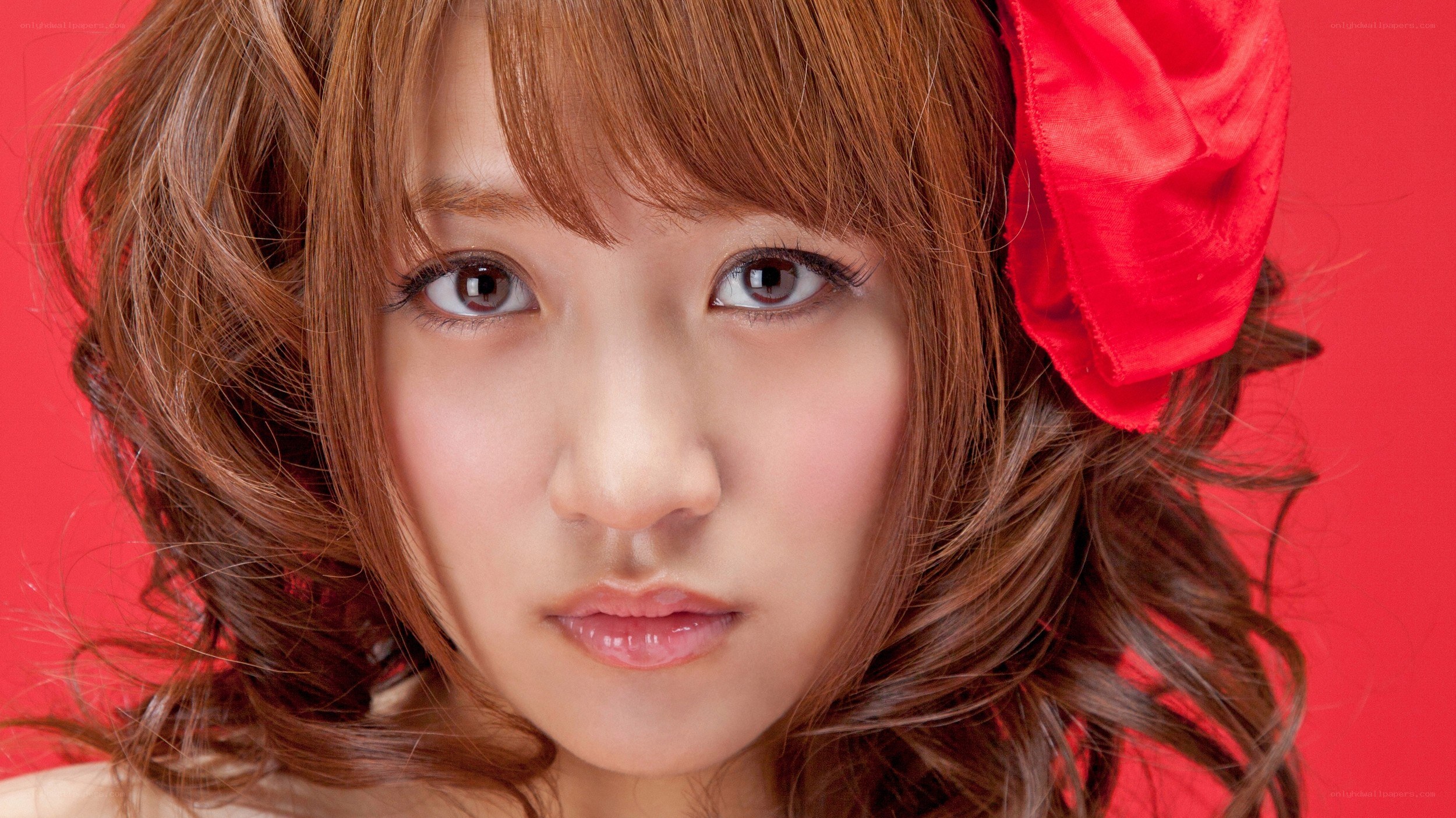 woman with red bow