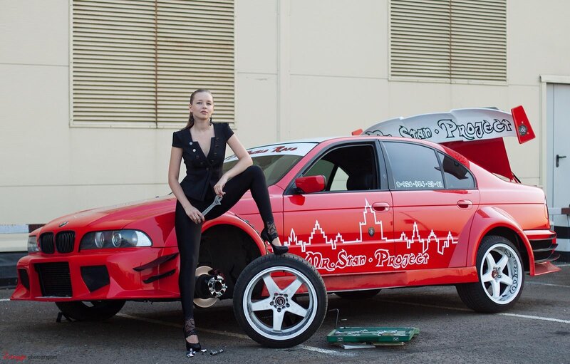 Woman with Red Car — Dramatic, Afternoon, Photograph, Tire