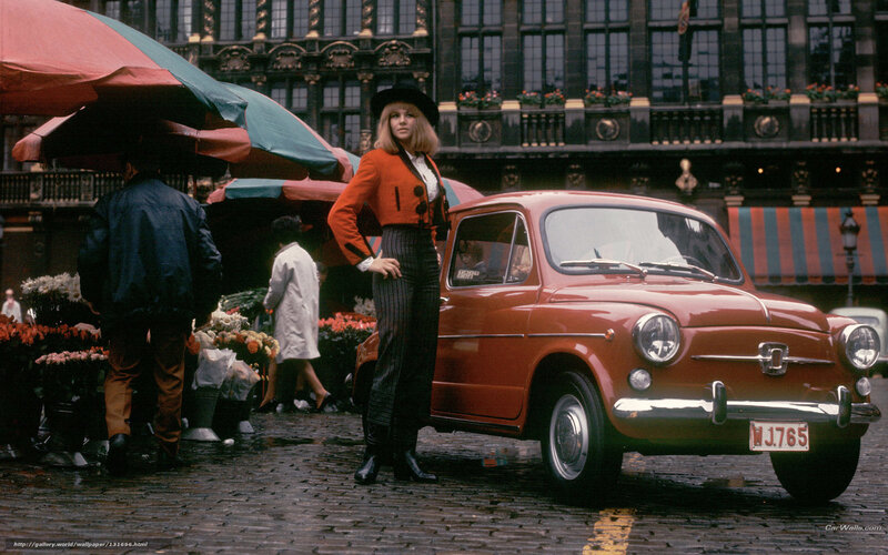 Woman with red car in market
