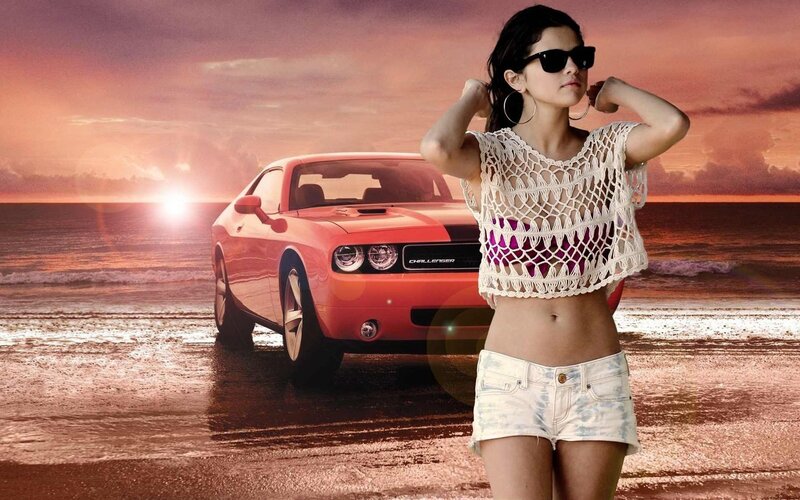 woman with red car on beach