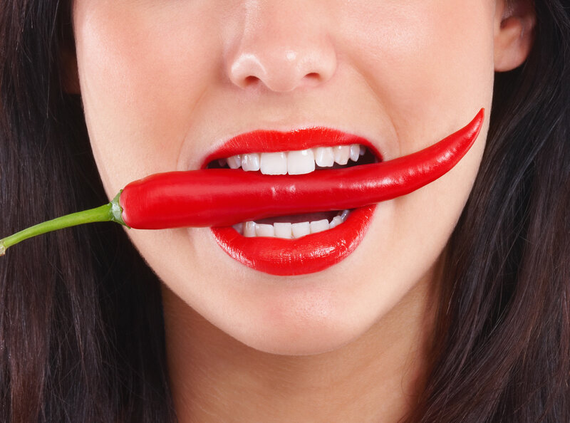 woman with red chili pepper