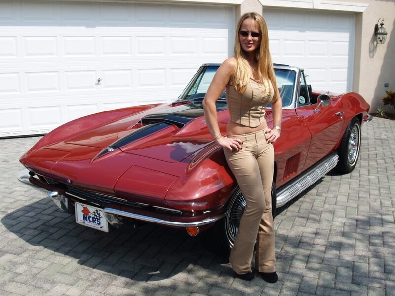 Woman with red classic car