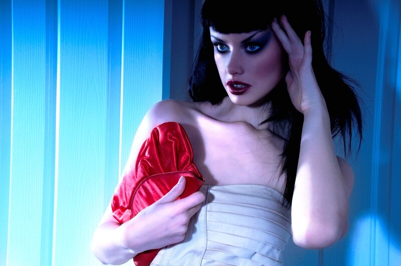 Woman with Red Clutch