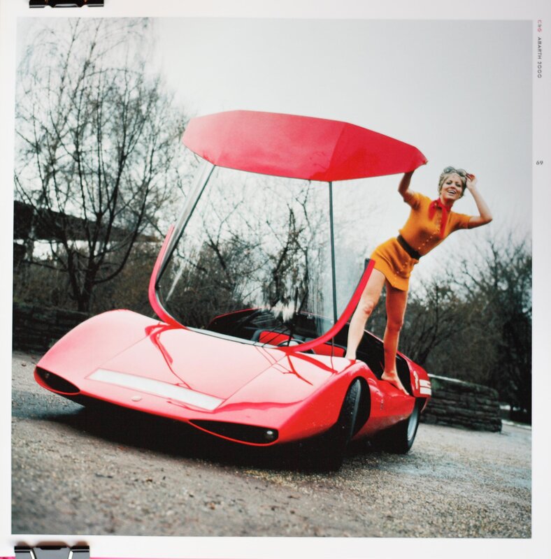 Woman with red concept car