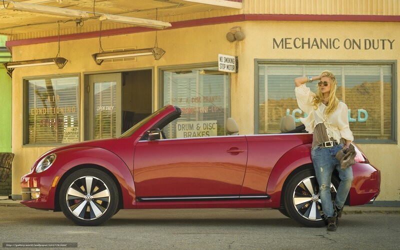 woman with red convertible car