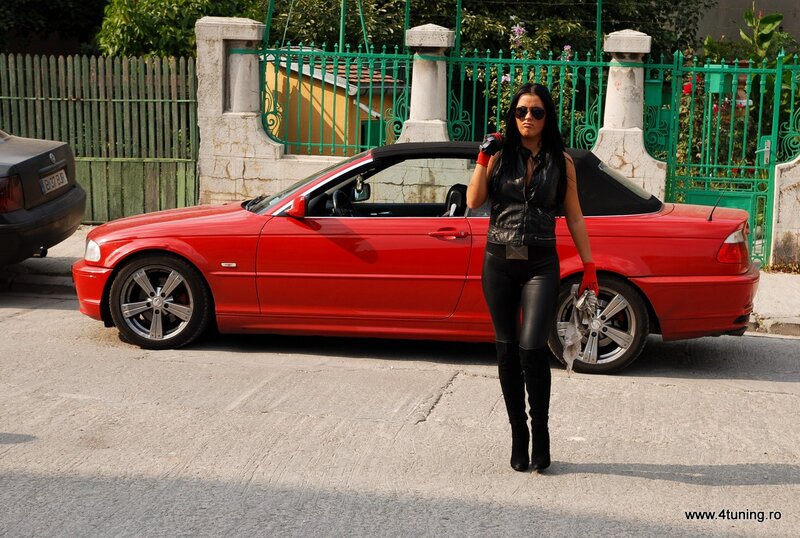 Woman with red convertible car