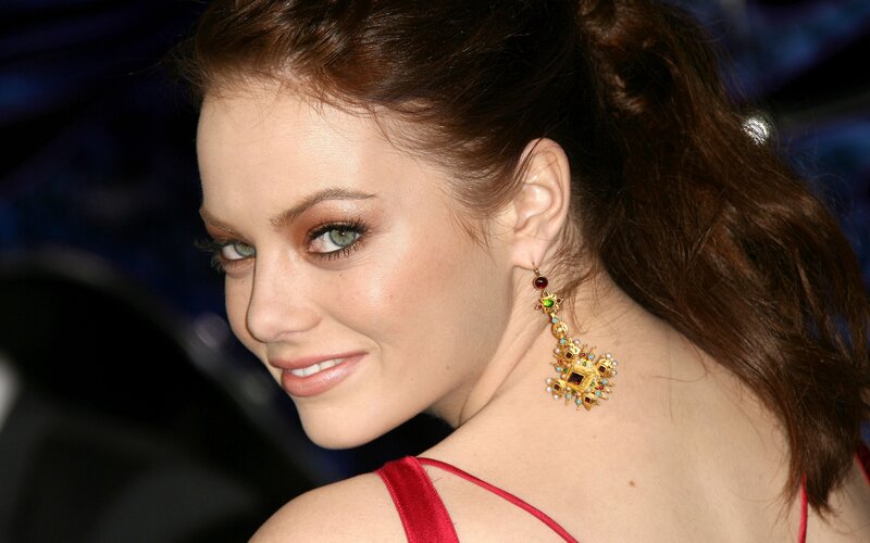 woman with red dress and earrings